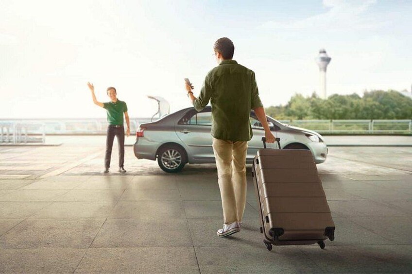 A man with a suitcase walking towards a car, a woman waving in the background, and a tower in the distance. 4