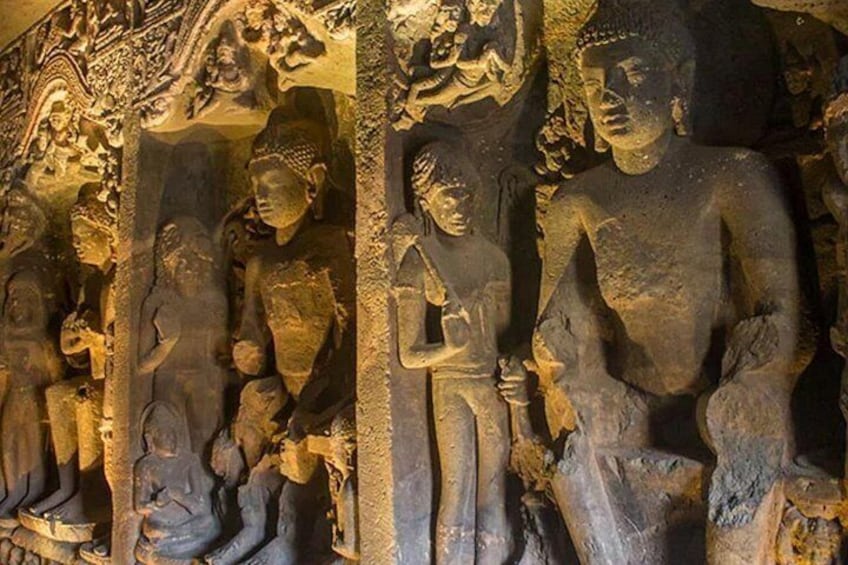 A series of stone statues in a cave. 5