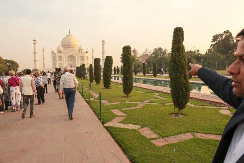 Tour guide Praveen 'Rocky' Tehriya explains features of the Taj Mahal during a private sunrise tour.