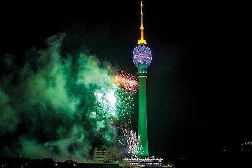 A tower with a spherical top, surrounded by fireworks. 4