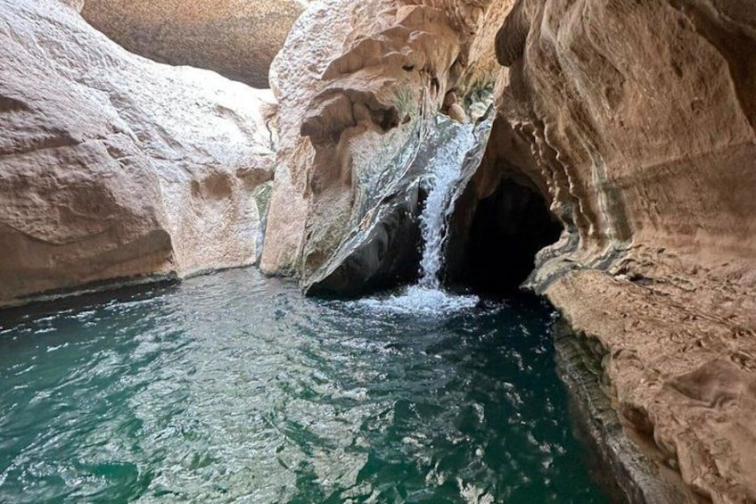 A natural rock formation with a waterfall. 3