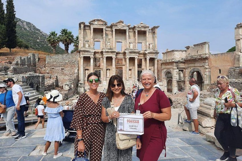 Tourists at the ancient ruins of Ephesus, with the Library of Celsus and the Temple of Artemis visible. 1