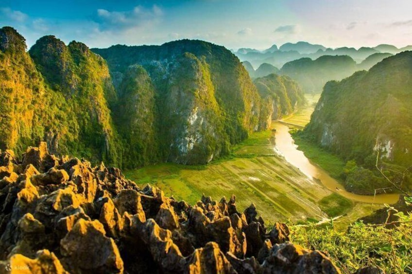 A river valley with steep cliffs and a rocky foreground. 3