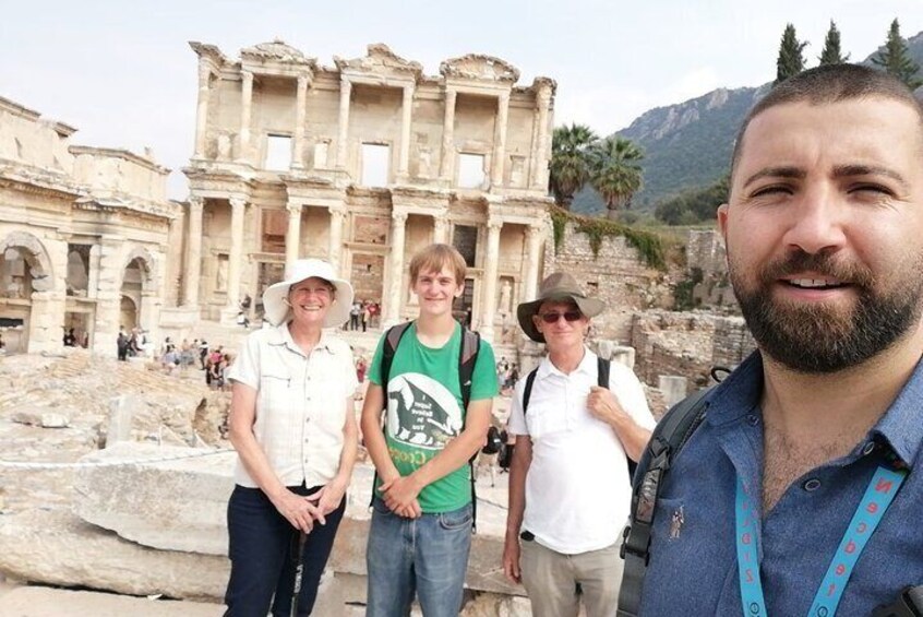 A historical site with ancient ruins, including a large amphitheater and columns. 2