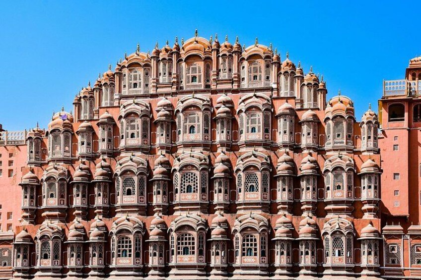 A large, ornate building with multiple domes and intricate window designs. 4