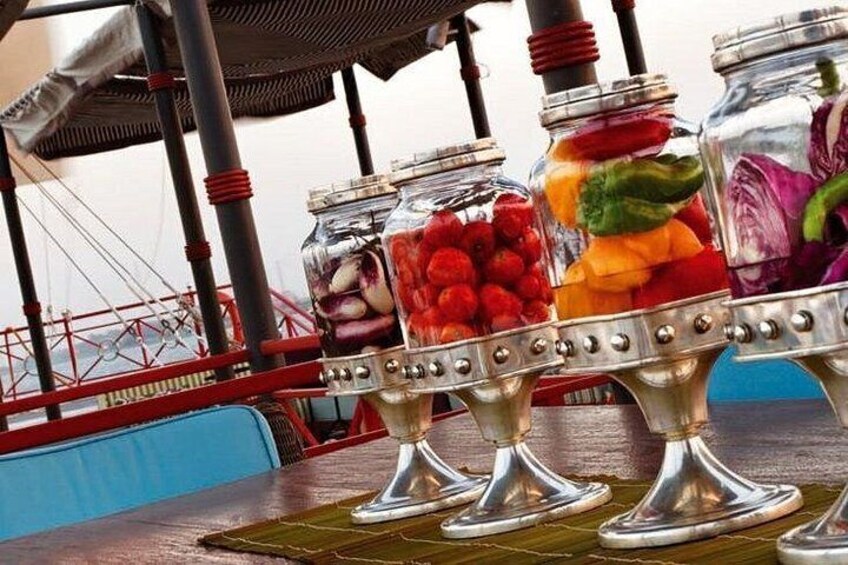 Jars of colorful pickled vegetables on a boat. 5