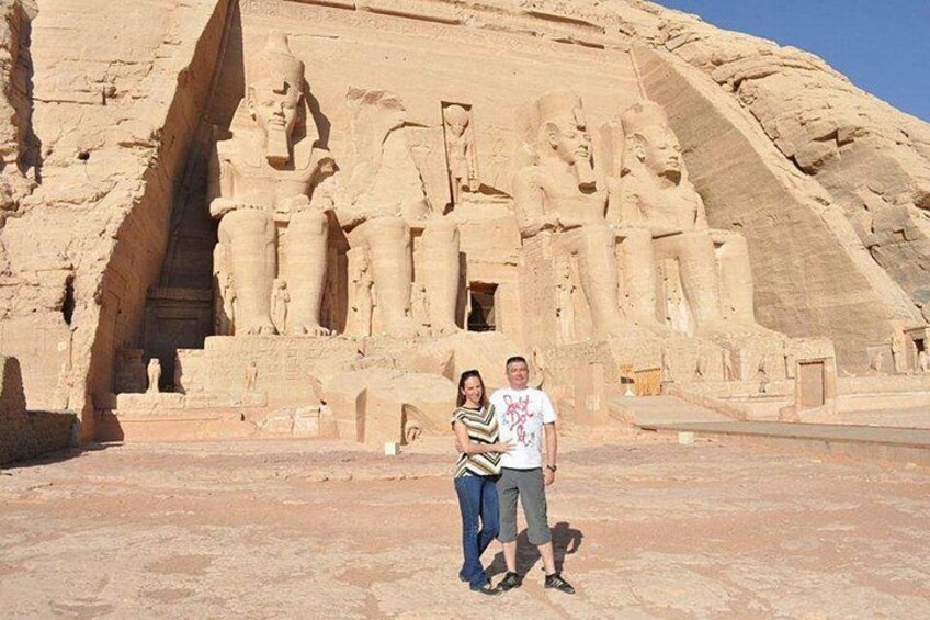 A large ancient Egyptian pyramid with hieroglyphics and statues. 2