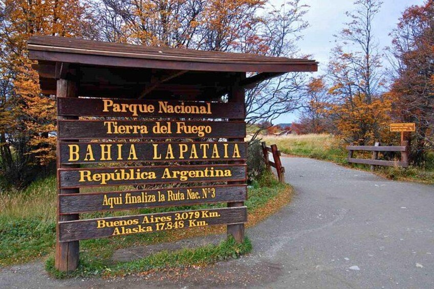 A wooden sign with text in Spanish, indicating a national park in Argentina. 3