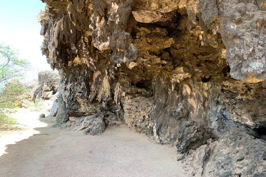 A rocky cliff with a path leading up to it. 3