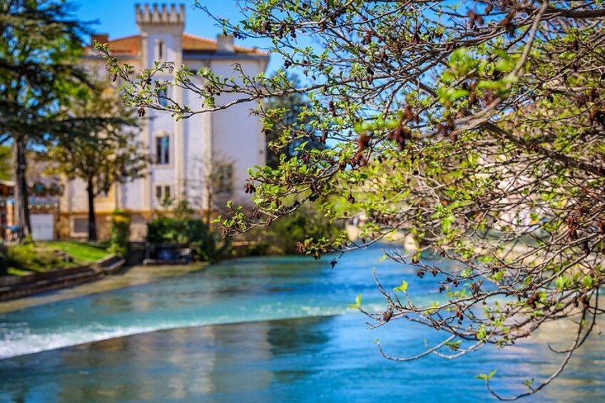 A river with a castle in the background. 1