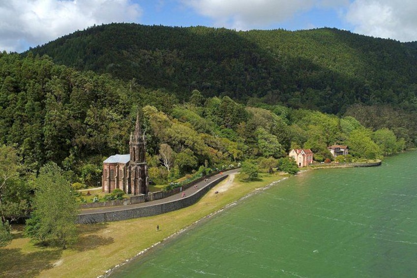 A church, a stone wall, and a river. 3