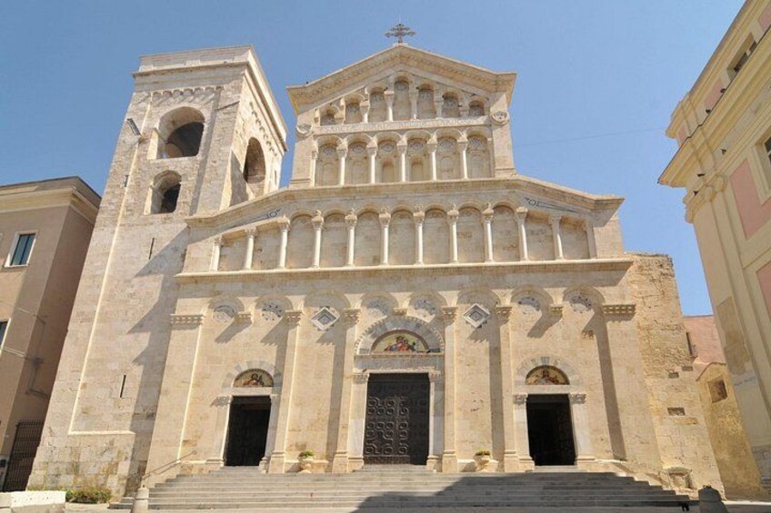 A historic church with a bell tower, arched windows, and a central doorway. 5