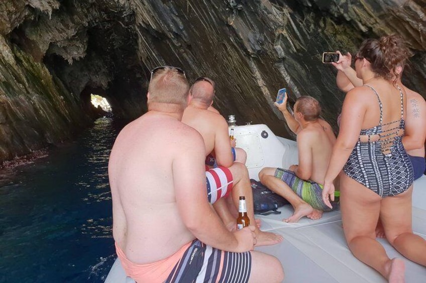 People on a boat in a cave-like waterway. 2