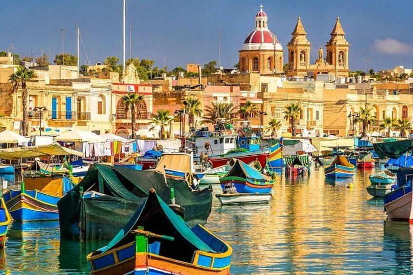 Marsaxlokk - the fishing village at the southern tip of Malta, is alive with fishing boats in the harbour, and has a bustling Sunday fish market. 1