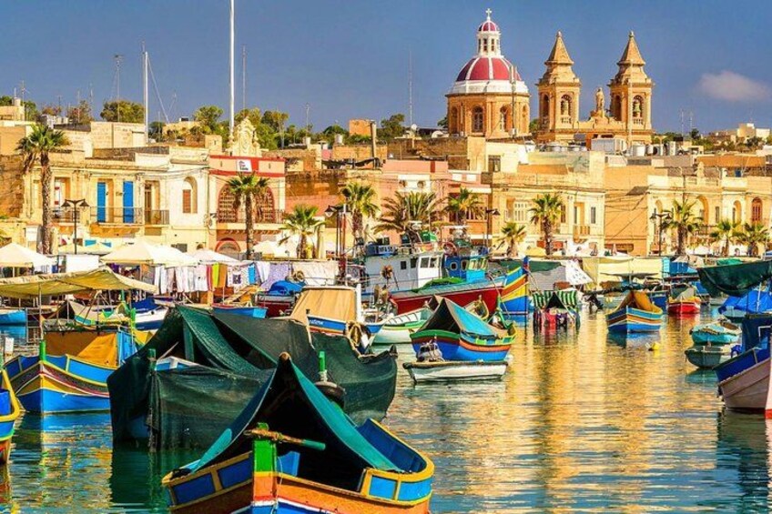 Marsaxlokk - the fishing village at the southern tip of Malta, is alive with fishing boats in the harbour, and has a bustling Sunday fish market. 1