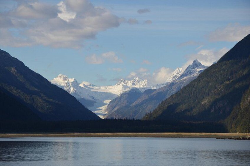 A mountain landscape with a lake and snow-capped peaks. 4
