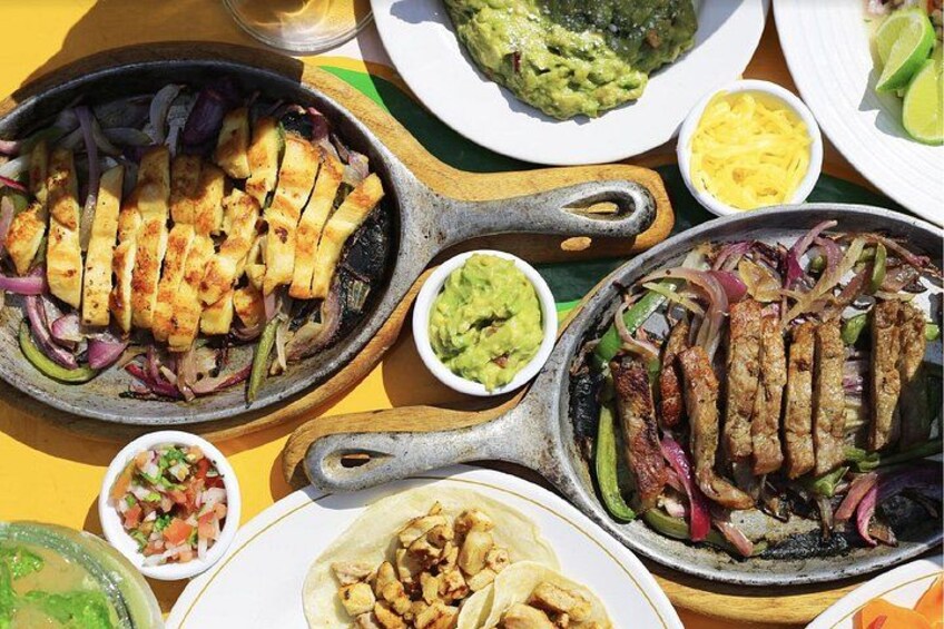A variety of grilled meats and vegetables on a table. 5