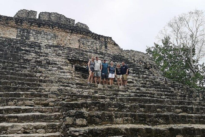 A group of people standing on ancient stone steps. 2