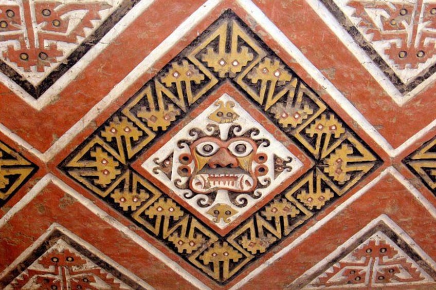 A detailed mosaic with geometric patterns and a central ornate design. 5