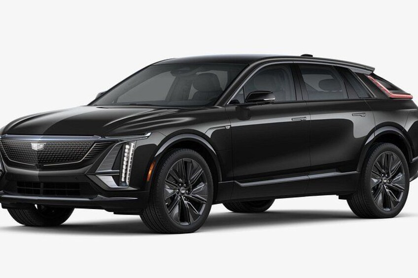 A black luxury SUV with a prominent grille, sleek headlights, and alloy wheels. 2