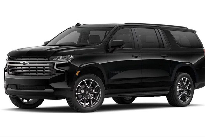 A black SUV with a chrome grille and alloy wheels. 3