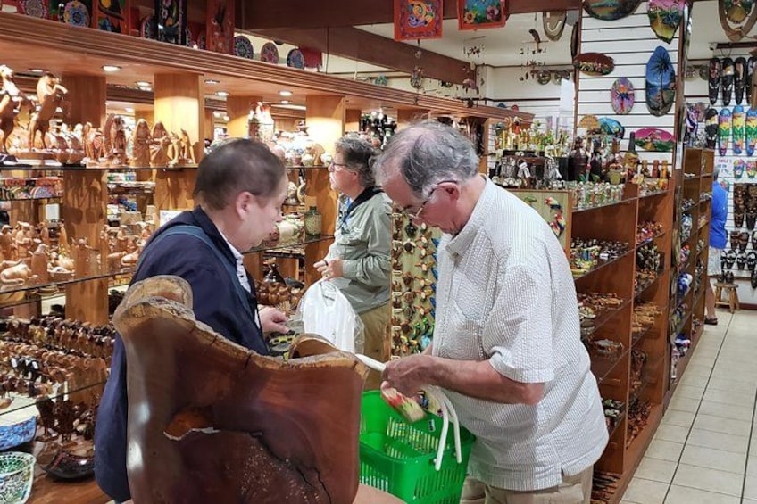 A store with wooden sculptures and pottery. 3