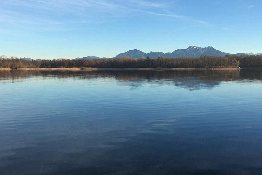 A calm lake with mountains in the background. 4