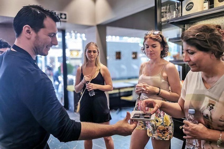 Geneva chocolate tour highlight: guests sampling artisan creations during a boutique tasting experience 5