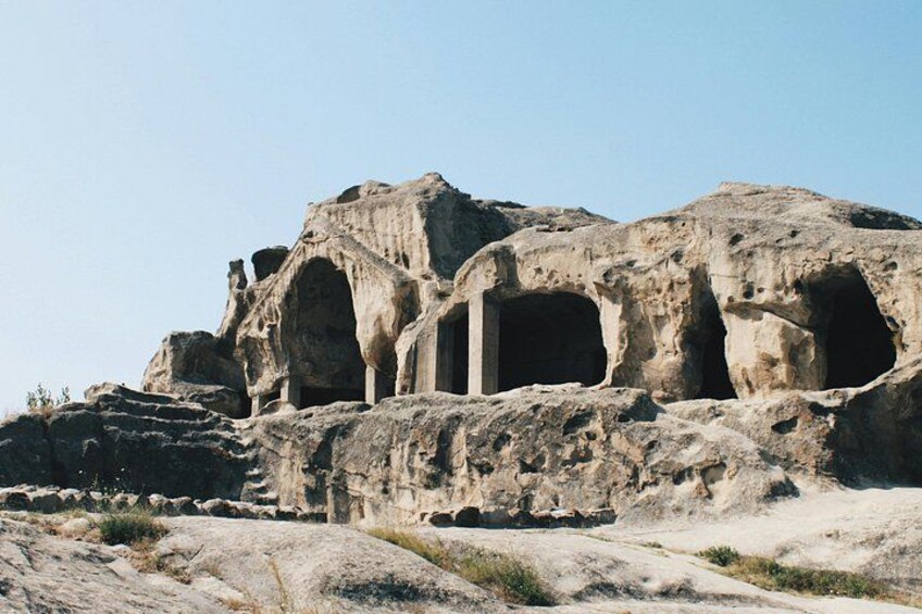 Ancient rock-cut architecture with multiple arches and columns. 2