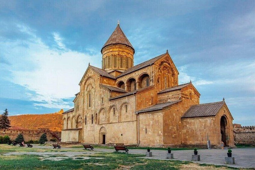 A historic church with a prominent dome and arched windows. 5