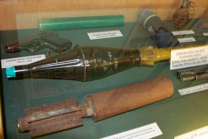 A display of various historical firearms and ammunition. 3