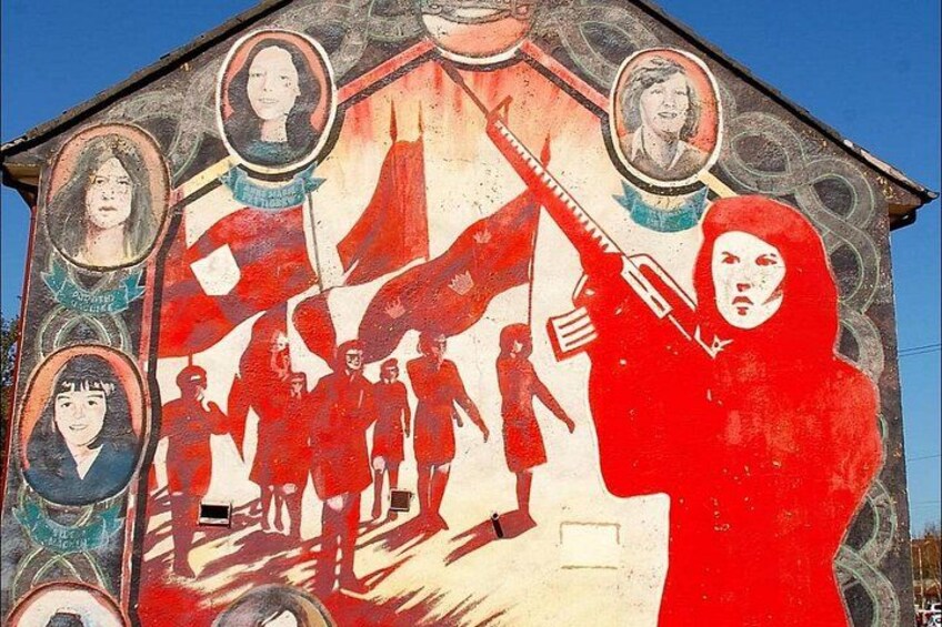 A mural with figures, a flag, and portraits. 3