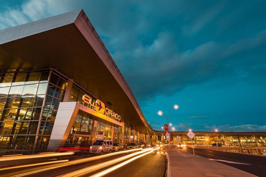 A modern building with a large glass facade and a prominent sign reading 'ELI ORACO'. 5