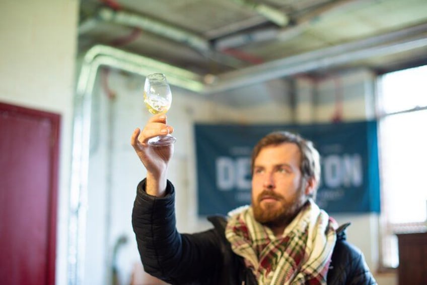 A person holding a wine glass. 2