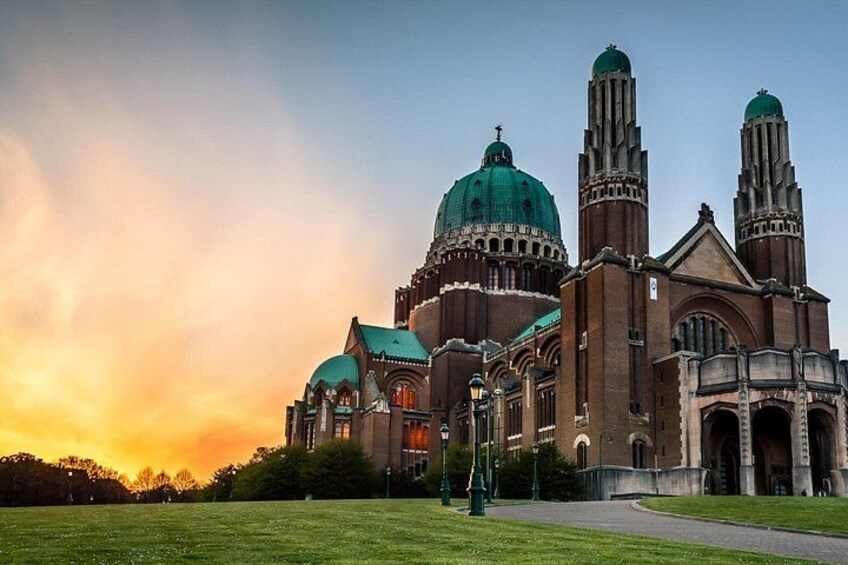 A large church with multiple domes and towers, surrounded by a grassy area. 4