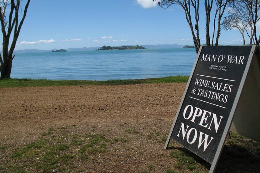 A signboard for Man O' War wine sales and tastings by the lake. 2