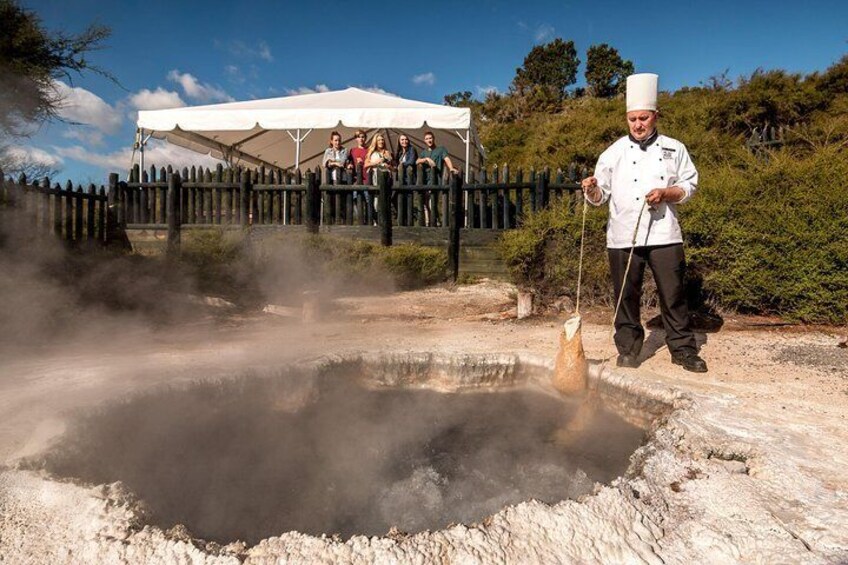 Cooking food in Natural boiling water- Te Puia Rotorua 