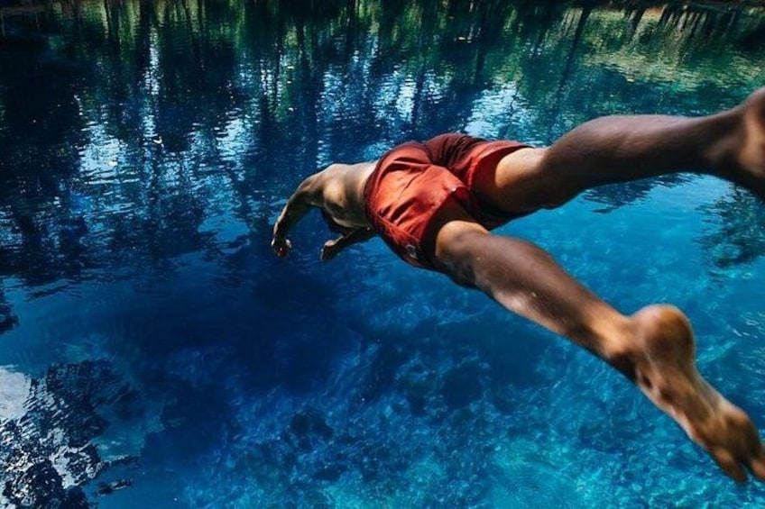 A person swimming in a pool. 4