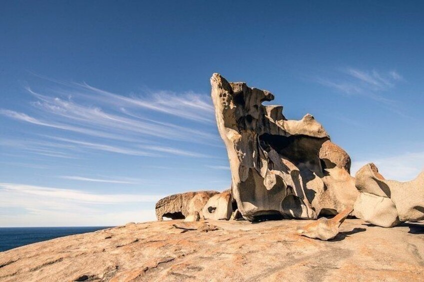 A rock formation with a cave-like opening. 1