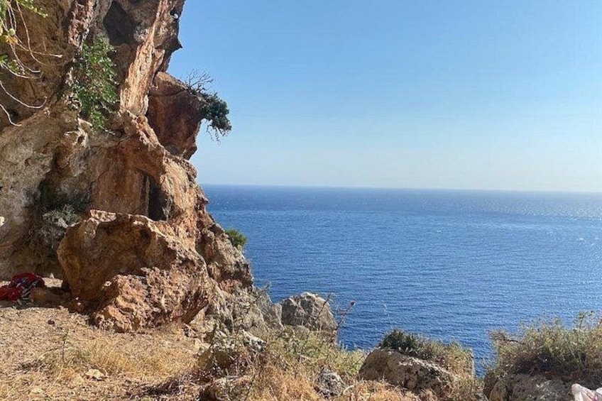A coastal cliff with a clear view of the ocean. 2