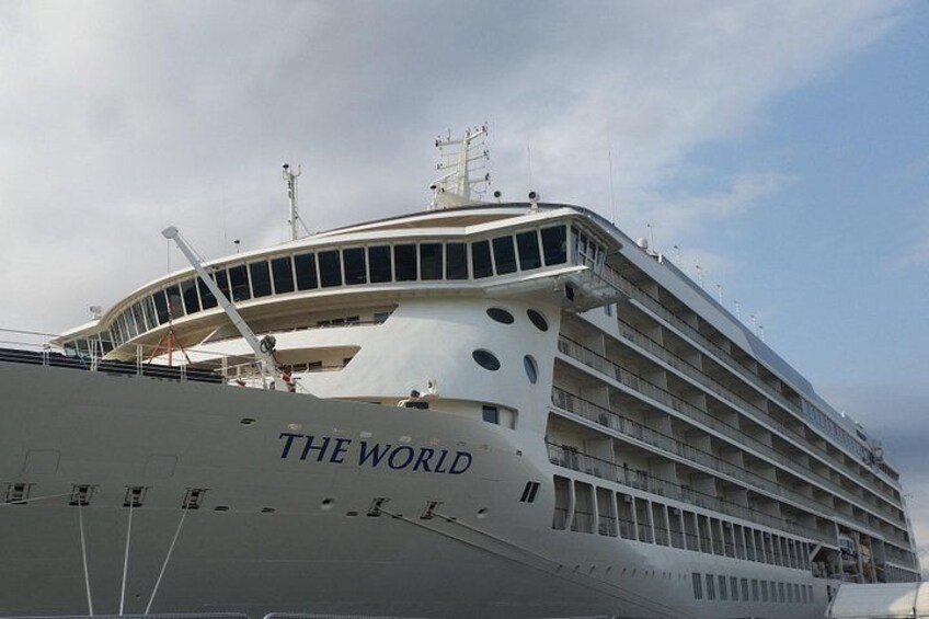A large cruise ship named 'The World' with multiple decks and balconies. 4