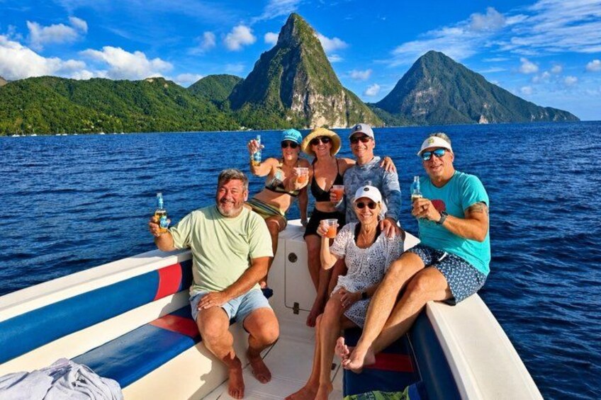 A group of people on a boat with a mountainous landscape in the background. 4