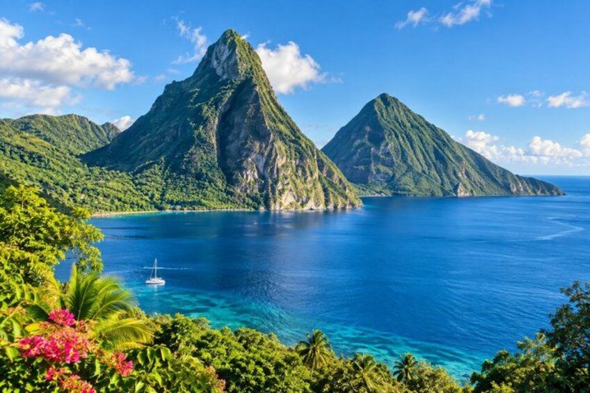 A clear blue sea, a white boat, and two green mountains. 3