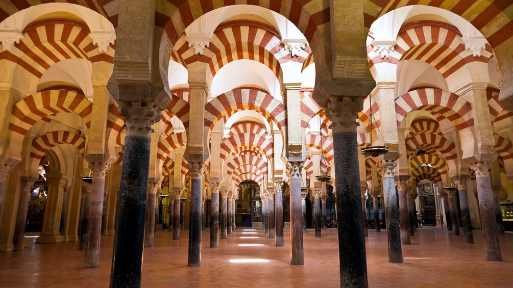 striped archways inside the Cathedral of Cordoba in Spain