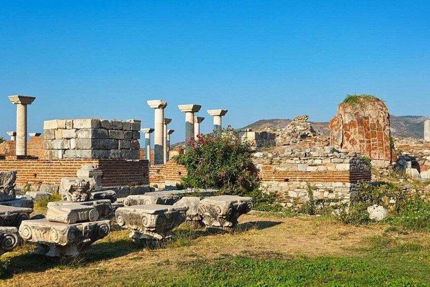 Ancient ruins with columns and stone structures. 3