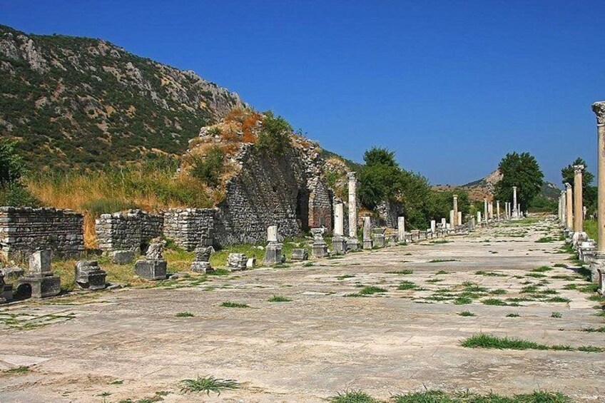 Ancient ruins with columns and stone structures. 4