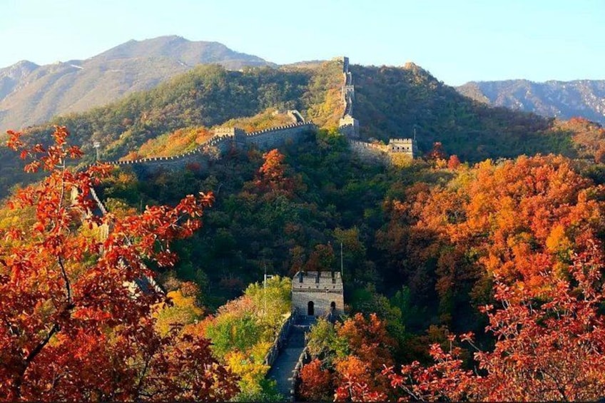 The Great Wall of China, autumn foliage, and mountainous terrain. 1