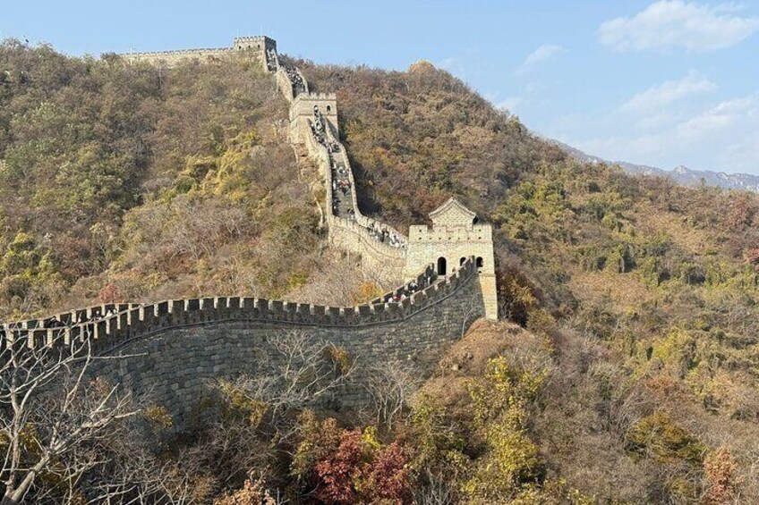 The Great Wall of China winding through a mountainous landscape. 4