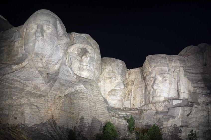 A closeup of Mount Rushmore Illuminated after the ceremony. 5