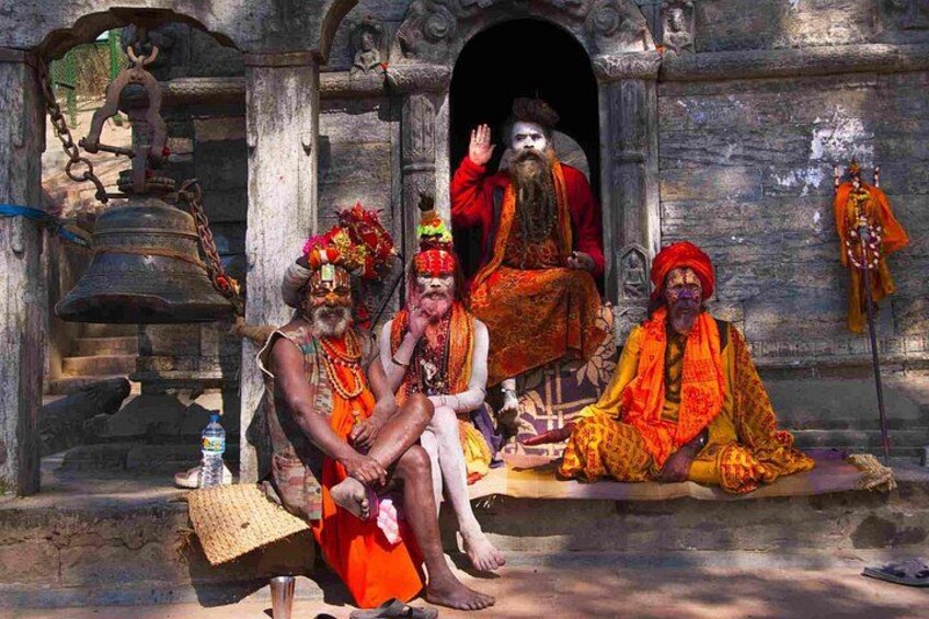 A temple entrance with a bell, a seated figure in red, and two standing figures in traditional attire. 5